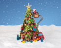 Mikołaj z dziećmi ubierający choinkę scenka LED ruchoma (480871)