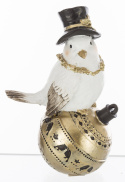 Ptaszek biały w czarnym kapeluszu na złotej bombce (159523)