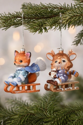 Glass ornament: Little fox on a sled (124024)